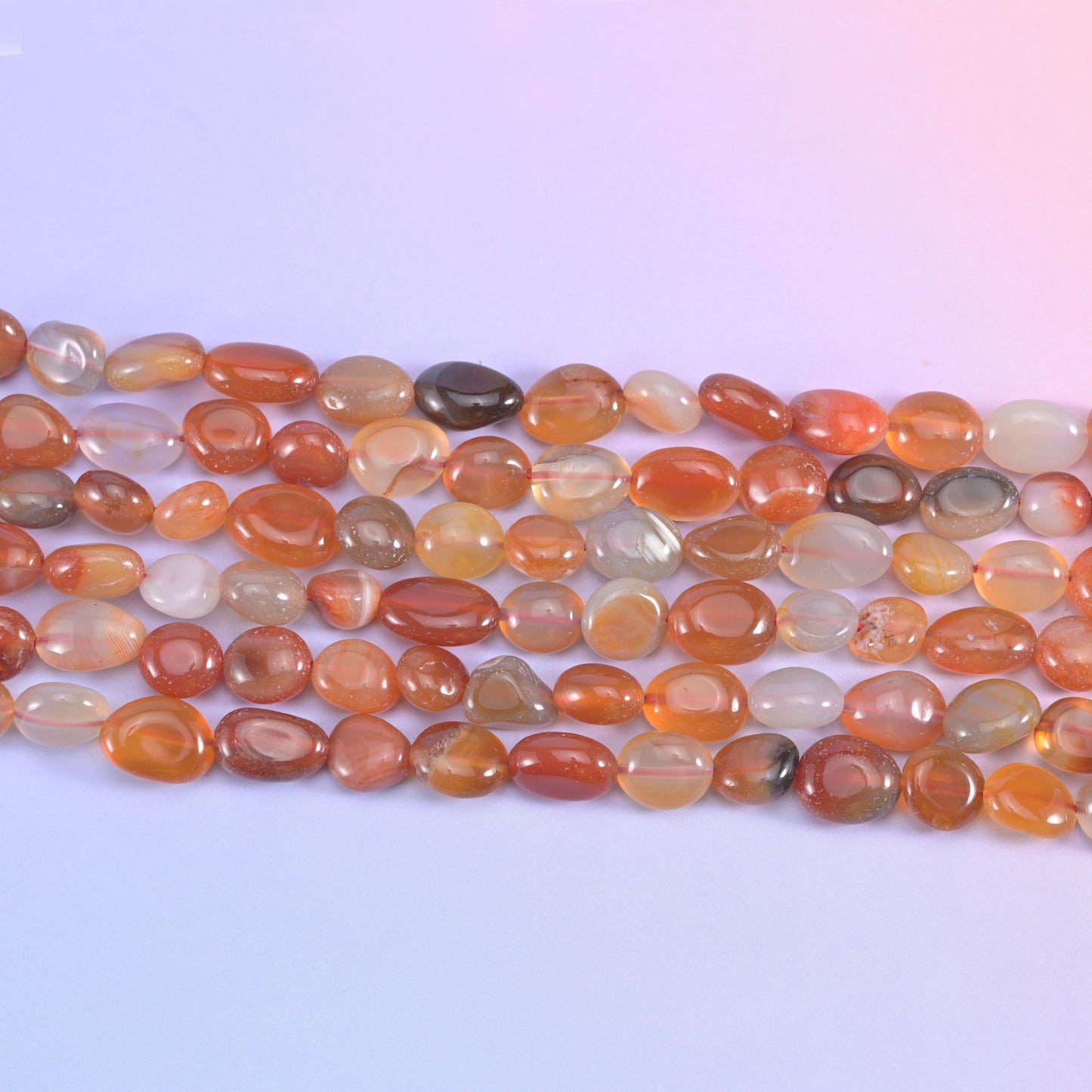Red Botswana agate nuggets in warm amber and rust orange