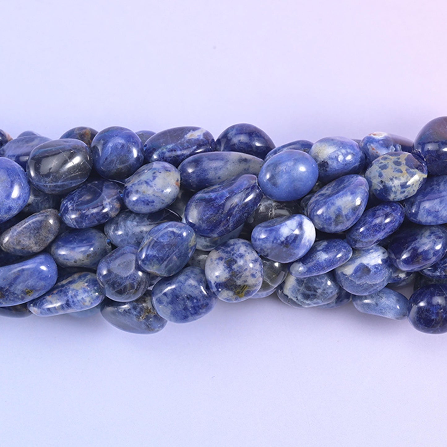 Close view of larger Sodalite nuggets with bold white streaking