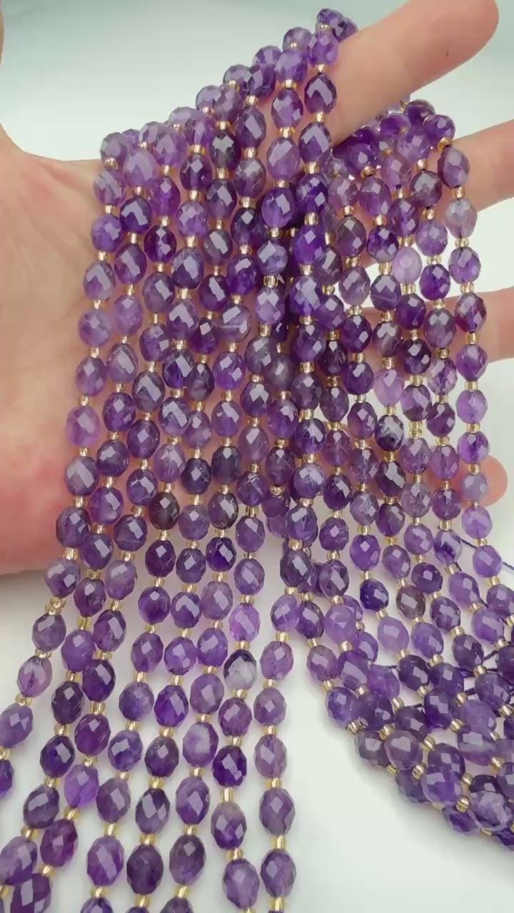 Violet barrels shading from pale lilac to deep grape, translucent and faceted all the way round