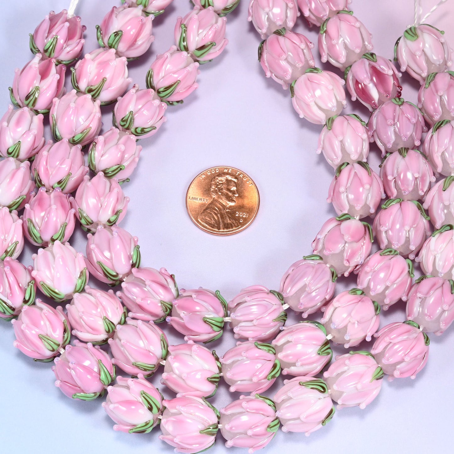 Pink tulip flower bud lampwork glass beads, approximately 20 beads per strand