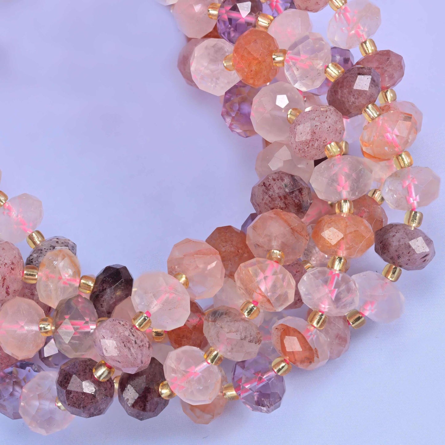 Faceted rondelle cut strawberry phantom quartz beads