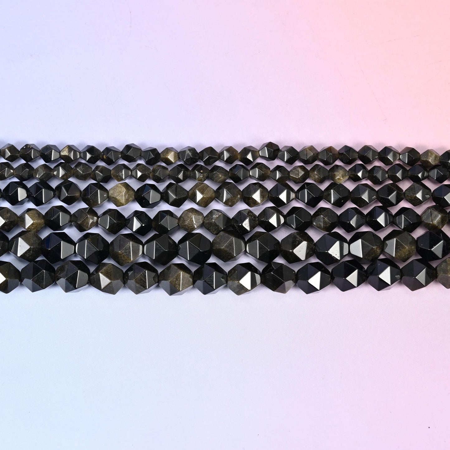 Gold Obsidian in near-black stone with a warm bronze-gold sheen