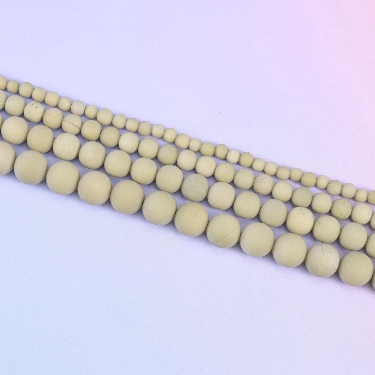 Green Alashan Agate Matte Round Beads in soft sage-olive with pale mottling