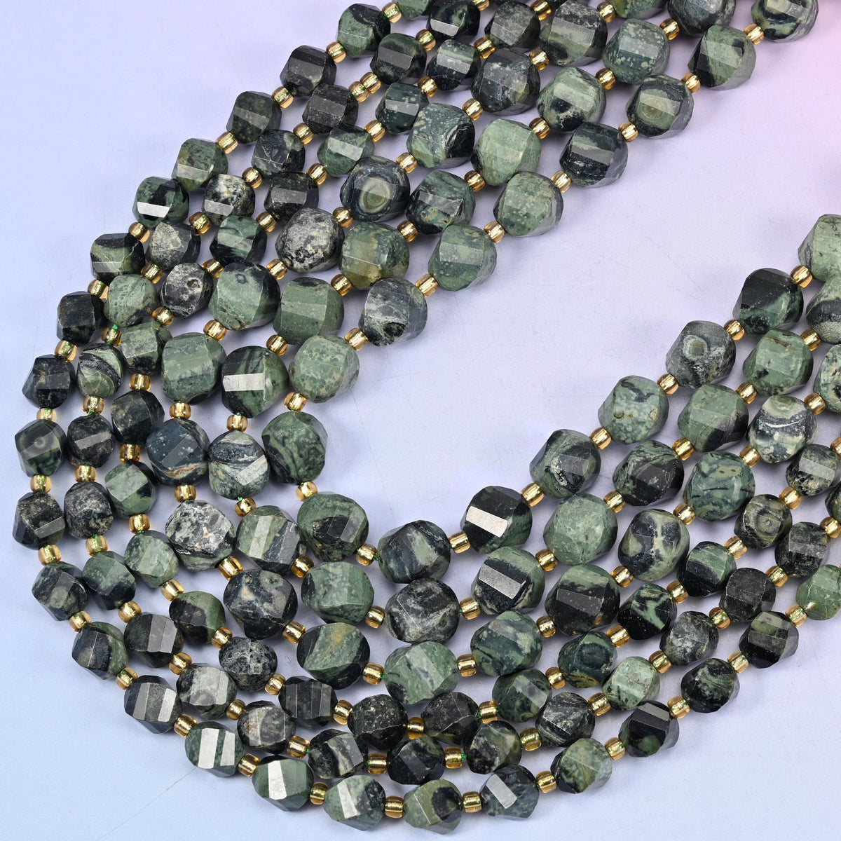 Kambaba Jasper faceted spiral twist beads, 15 inch strand