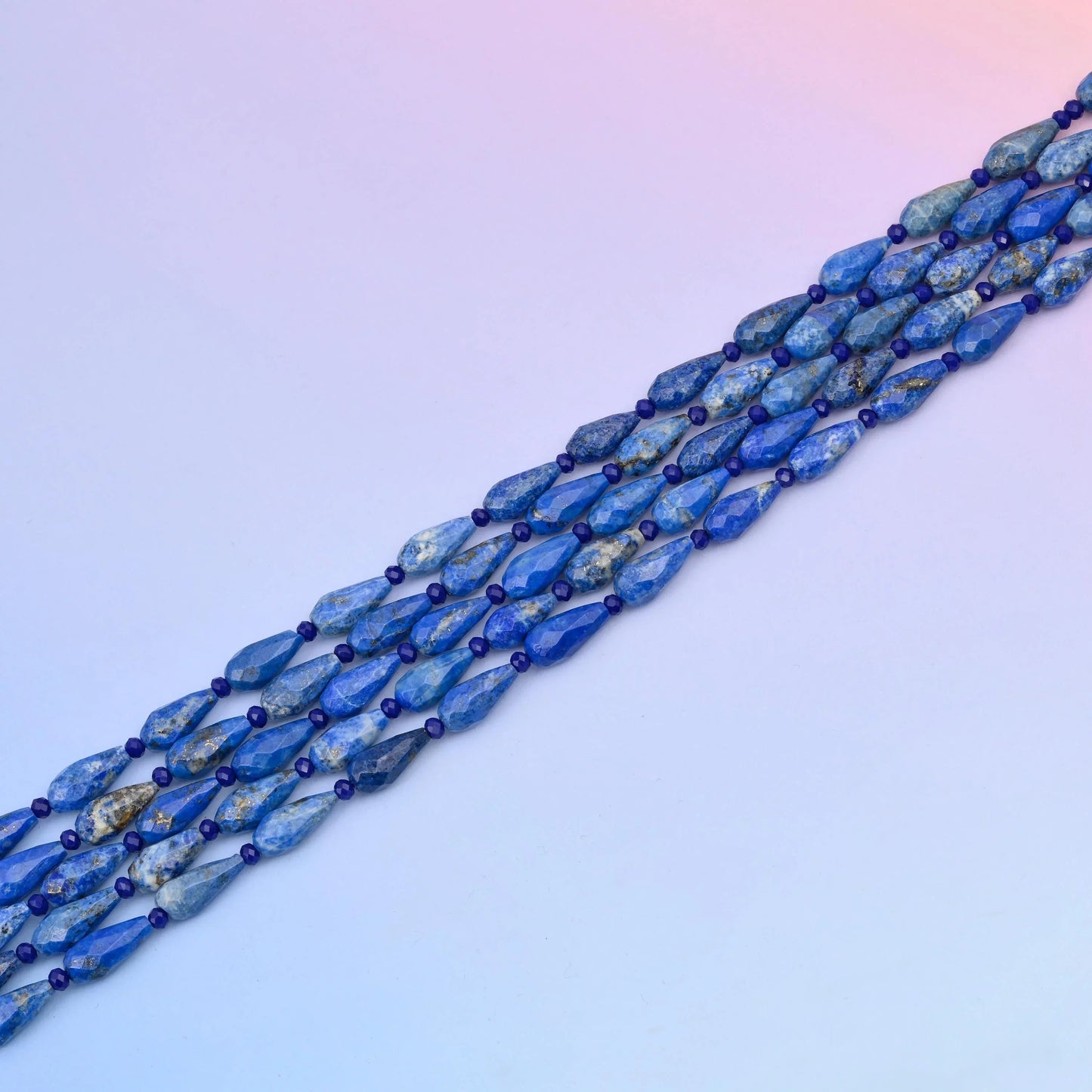 Lapis teardrop beads in royal blue with grey-white calcite veining