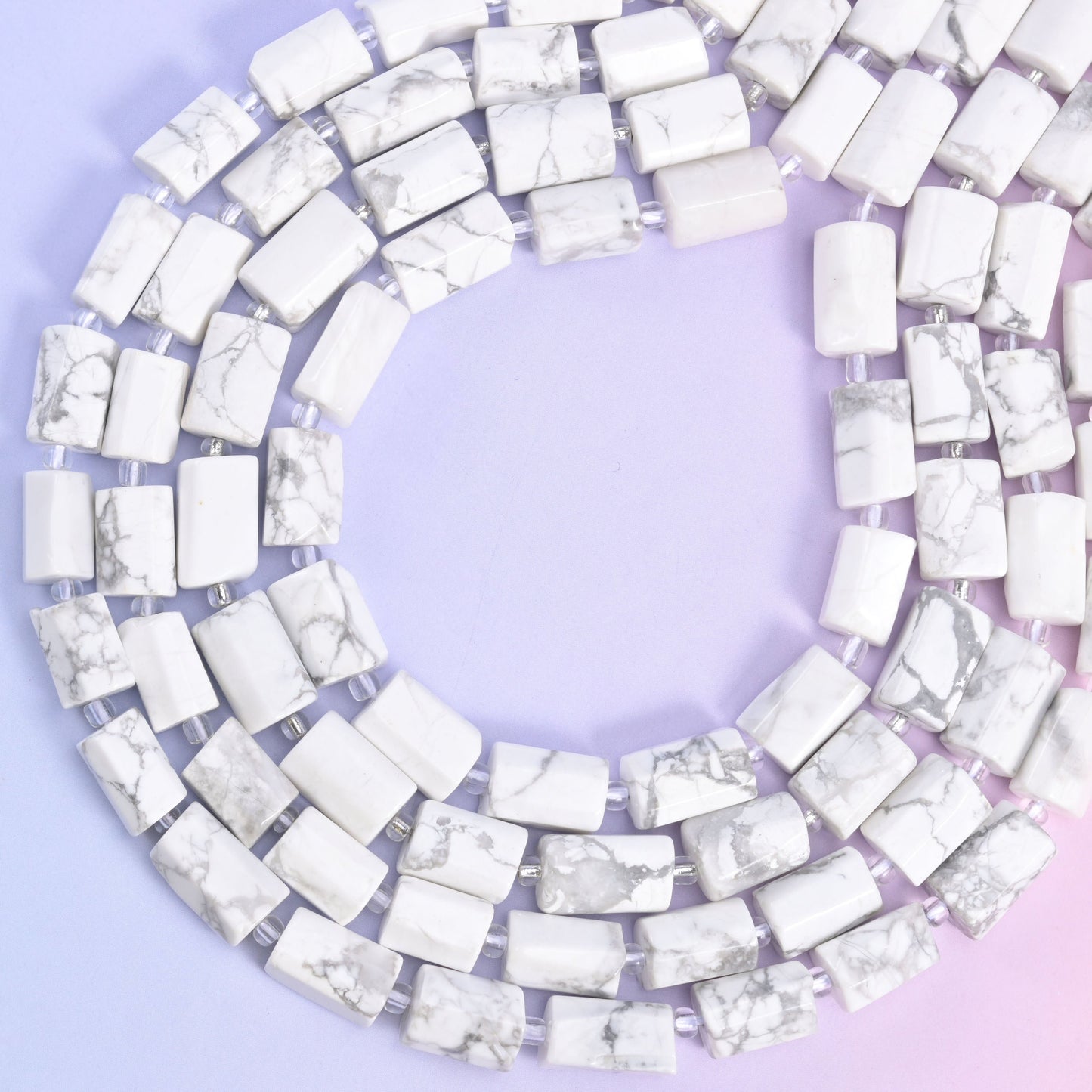 White Howlite faceted tube beads, approximately 29 beads per strand