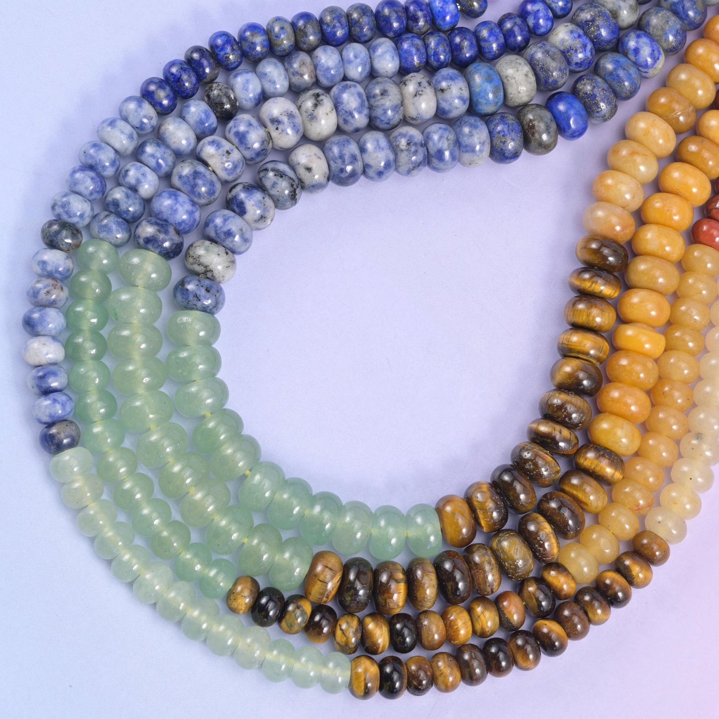 Seven stones on one strand — red jasper, tiger eye, green aventurine, blue spot jasper, lapis, yellow jade and amethyst
