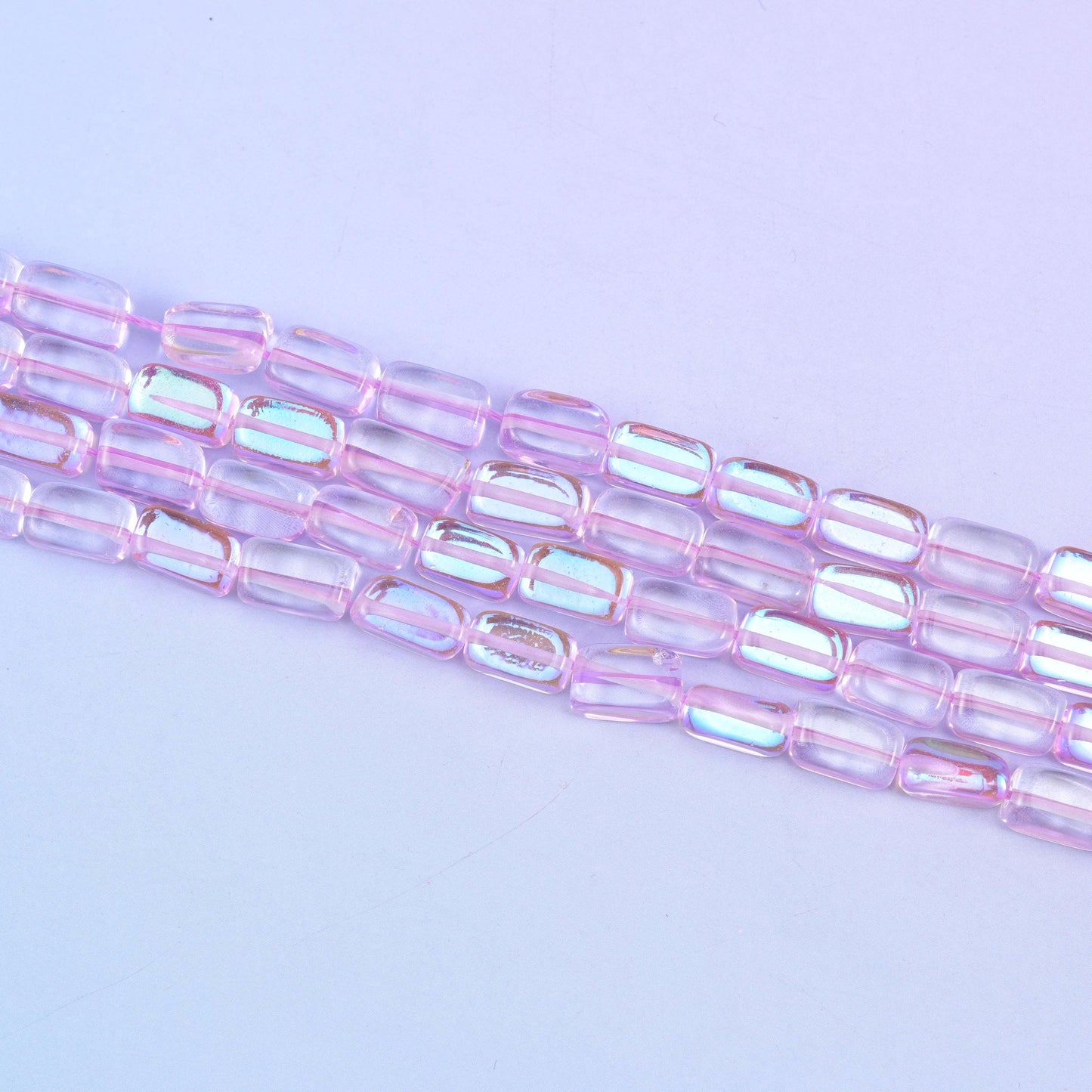Light purple mystic aura beads in soft lilac-pink with a subtle iridescent glow