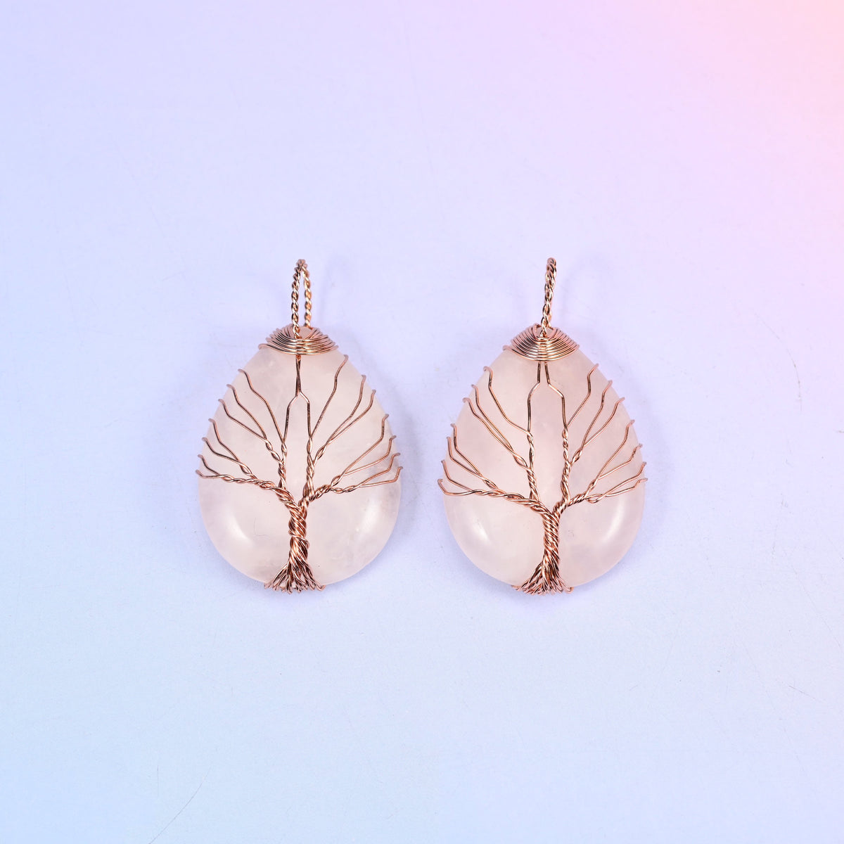 Teardrop Crystal Pendant with Copper Wired Tree in blush pink rose quartz, two pieces side by side with bare copper branches over the polished cabochon.