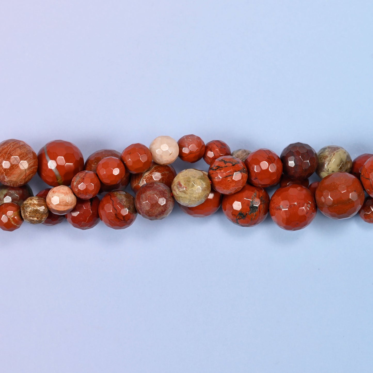 End detail of a flower red jasper beaded strand (15-inch strand), showing bead spacing.
