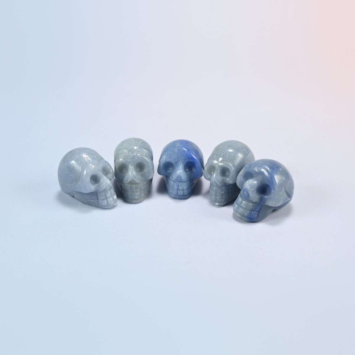 1 inch skull crystal carving in blue aventurine, blue natural stone with a soft shimmer