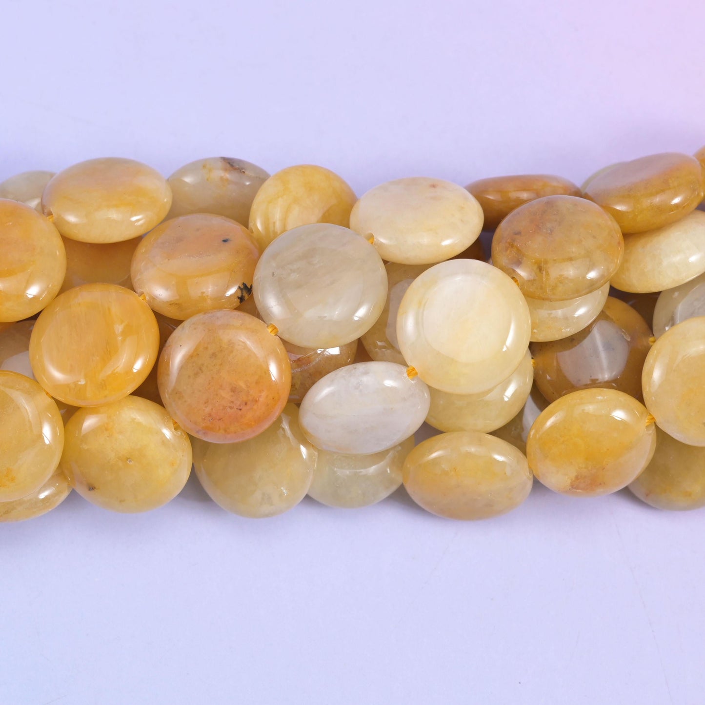 Coin cut Yellow Jade beads with a smooth satin polish