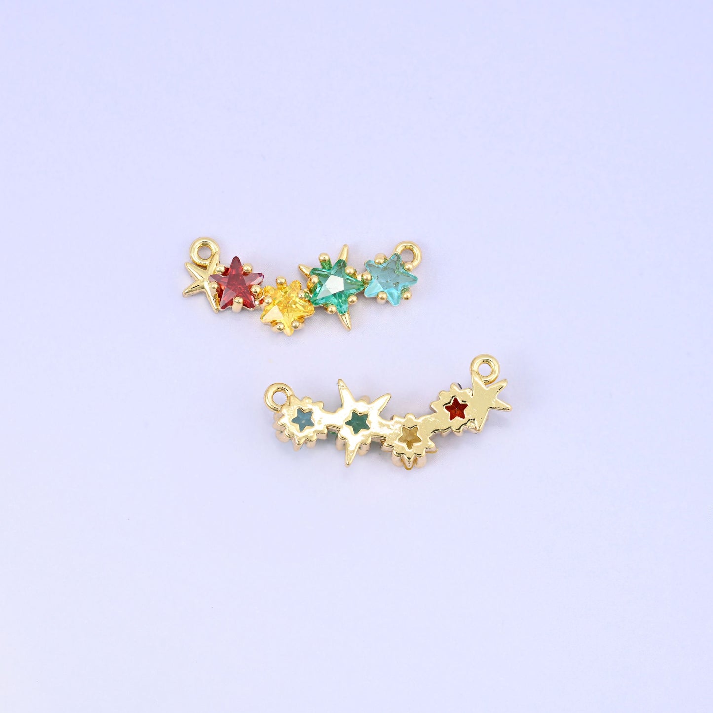 Four star zircon connector pendants in garnet red, lemon yellow, mint green and aqua