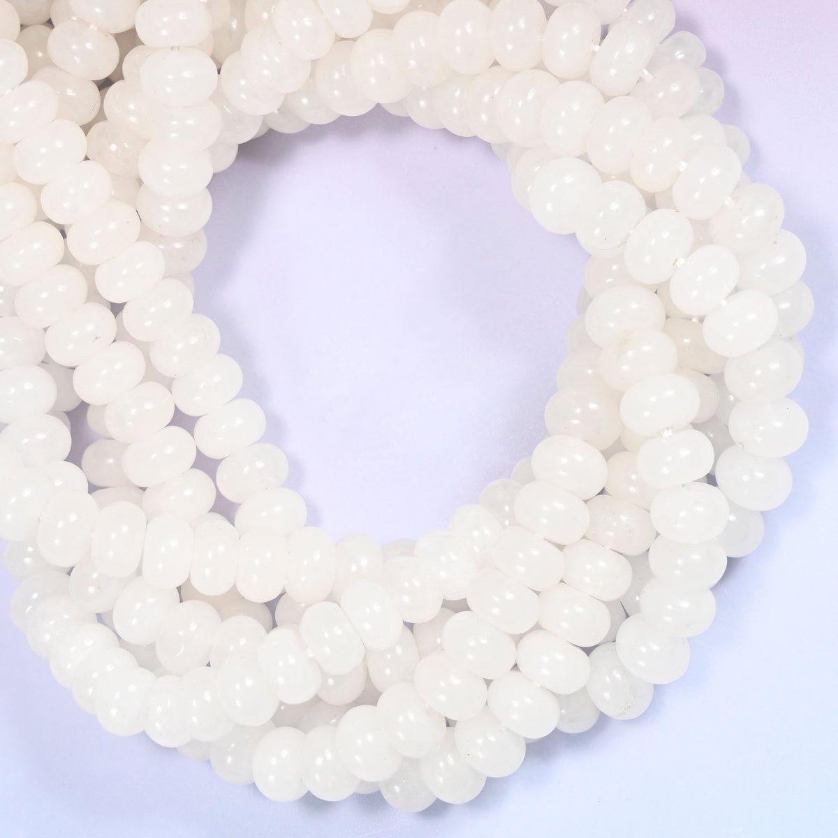White Jade rondelle beads, close view of the coiled strands showing creamy white