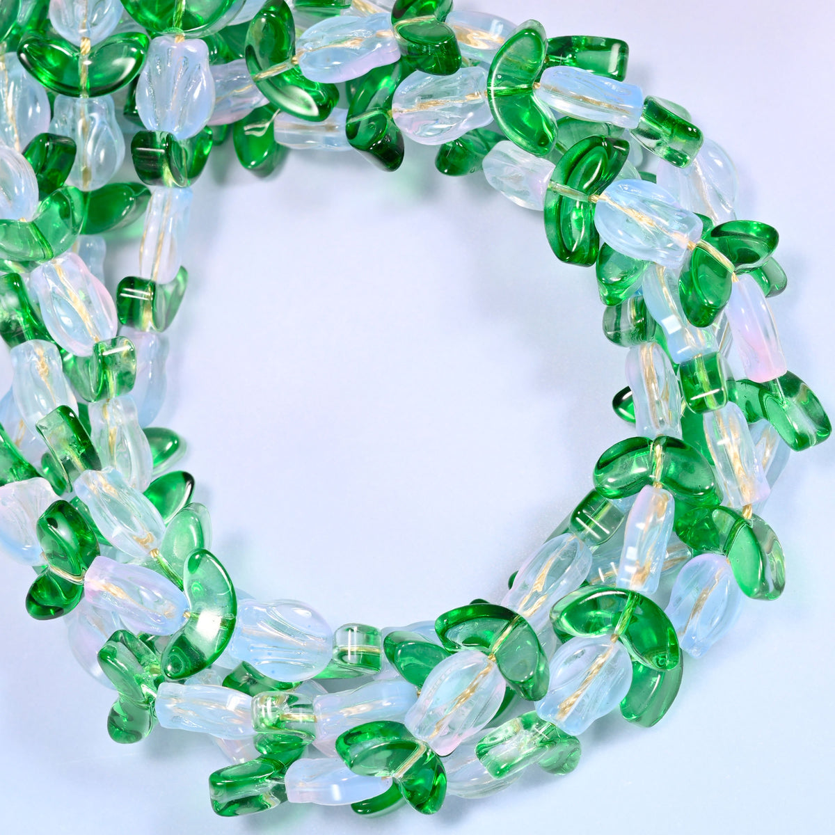 White Tulip Flower glass beads with leaf, close view of the coiled strands in clear white flower buds alternating with green glass leaves