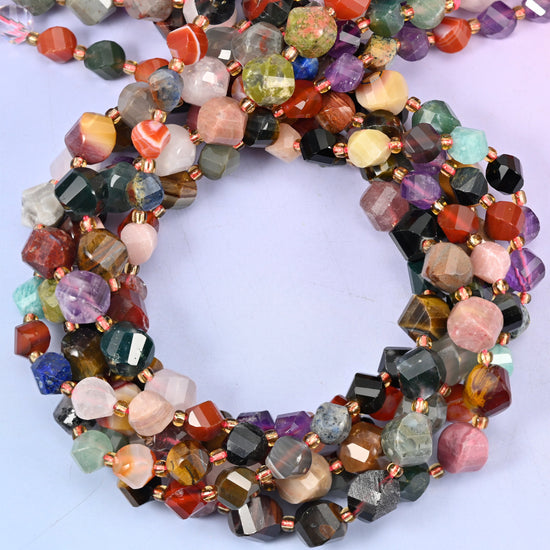 Assorted gemstone faceted spiral twist beads, close view of the coiled strands mixing many stone colours with small gold spacers