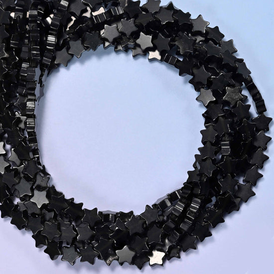 Black Obsidian flat star beads, close view of the coiled strands in glossy black