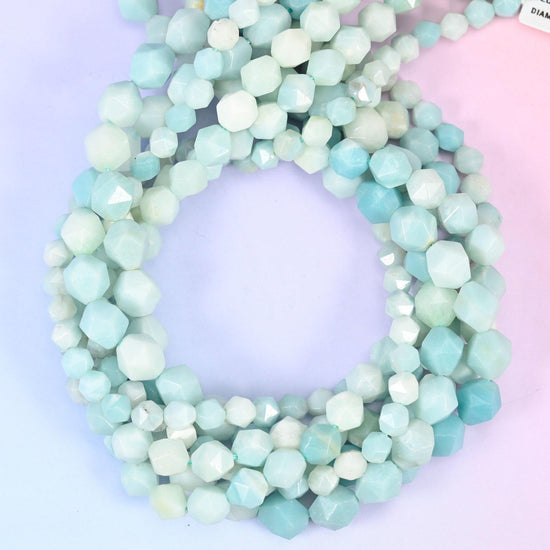 Blue Amazonite faceted diamond star cut beads, close view of the coiled strands showing pale aqua and cream