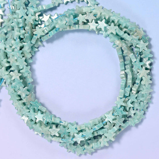 Blue Amazonite flat star beads, close view of the coiled strands in soft seafoam blue-green