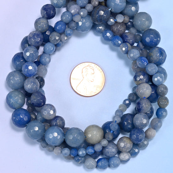 Blue Aventurine faceted round bead strands coiled around a US penny for size reference