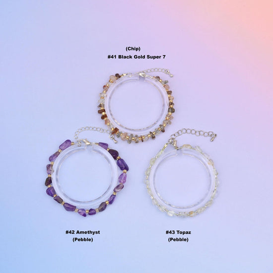 Three chip gemstone bead bracelets labelled number 41 Black Gold Super 7 in chip cut, number 42 Amethyst and number 43 Topaz in pebble cut, each with silver plated clasp and extender chain
