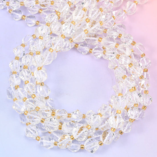 Clear Quartz faceted spiral twist beads, close view of the coiled strands showing the clear to milky white facets