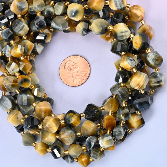 Dream Tiger Eye faceted spiral twist bead strands coiled around a US penny for size reference