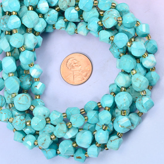 Dyed Light Blue Howlite faceted spiral twist bead strands coiled around a US penny for size reference