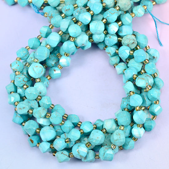 Dyed Light Blue Howlite faceted spiral twist beads, close view of the coiled strands in turquoise blue with grey veining