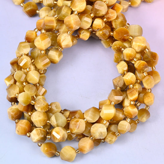 Gold Tiger Eye faceted spiral twist beads, close view of the coiled strands showing honey gold with a silky chatoyant sheen