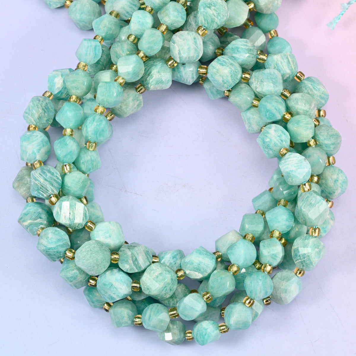 Green Amazonite faceted spiral twist beads, close view of the coiled strands showing sea green with white streaking