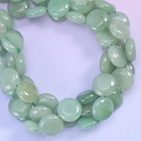 Green Aventurine smooth coin beads, close view of the coiled strands showing soft translucent green