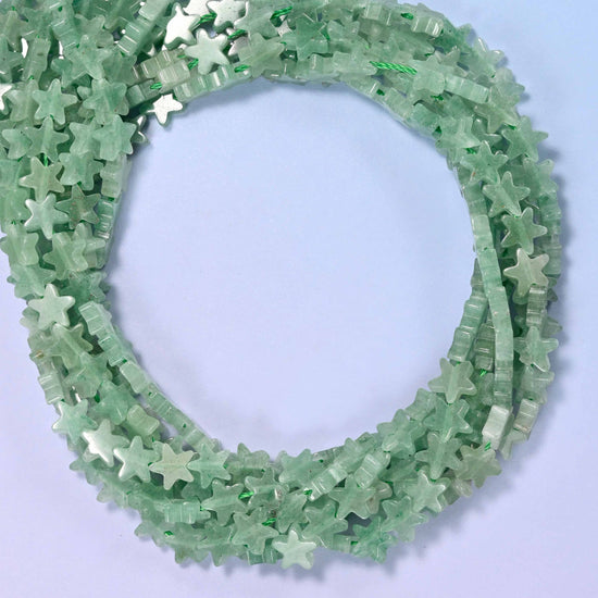 Green Aventurine flat star beads, close view of the coiled strands in soft green