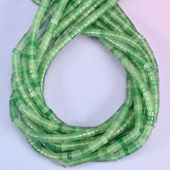 Green Aventurine smooth heishi disc beads, close view of the coiled strands showing the even green colour