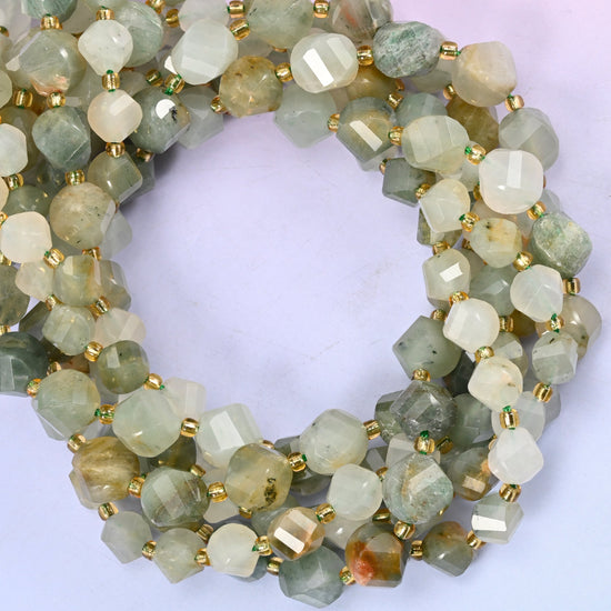 Green Grass Silk Stone faceted spiral twist beads, close view of the coiled strands in sage green and cream
