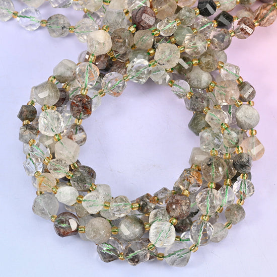 Green Phantom Quartz faceted spiral twist beads, close view of the coiled strands in soft green and clear stone with brown-green inclusions