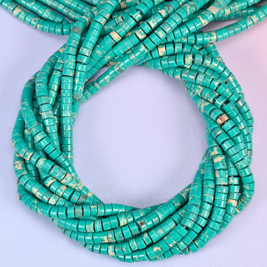 Green Shoushan Stone smooth heishi disc beads, close view of the coiled strands showing turquoise green with tan matrix flecks
