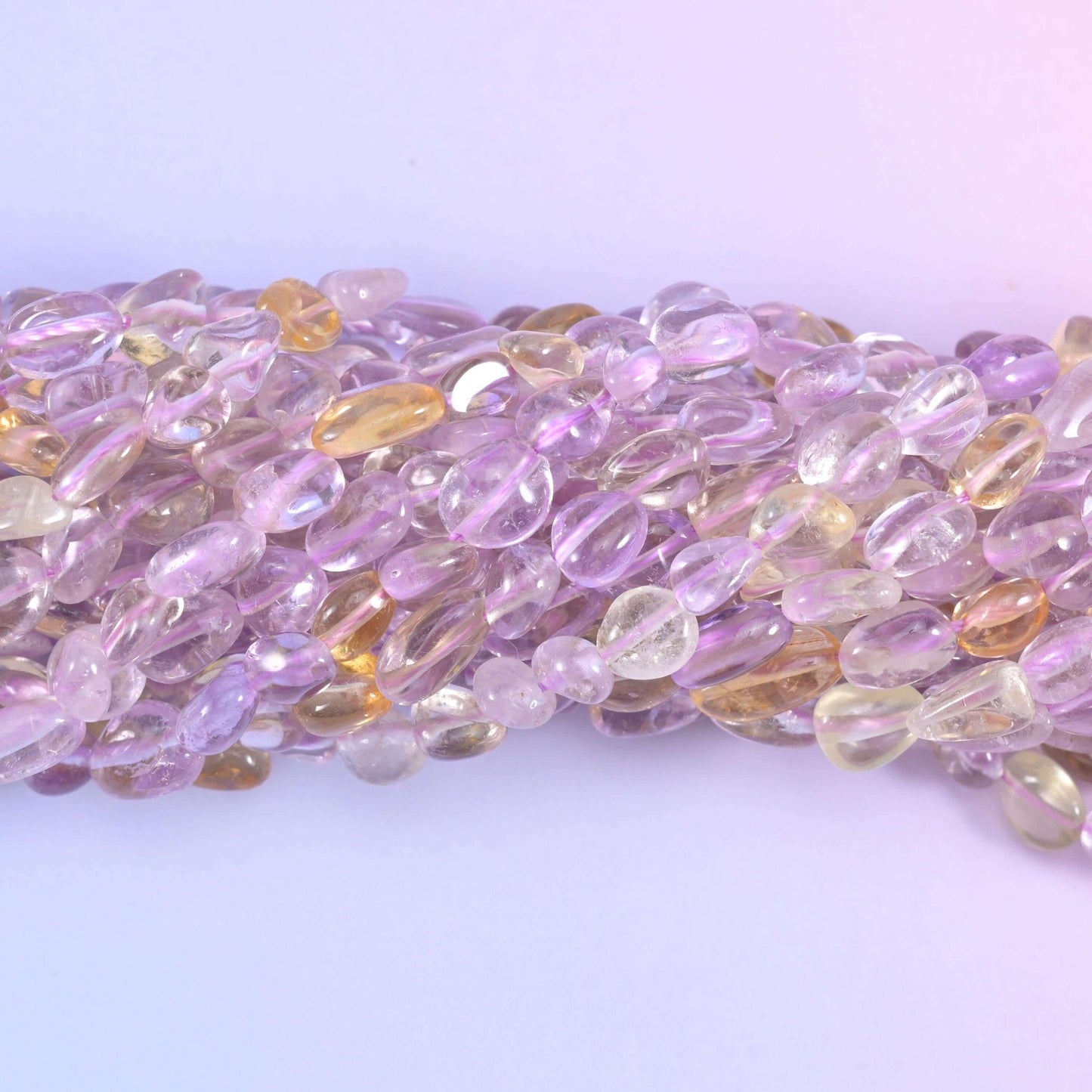 Ametrine pebble nugget gemstone beads.
