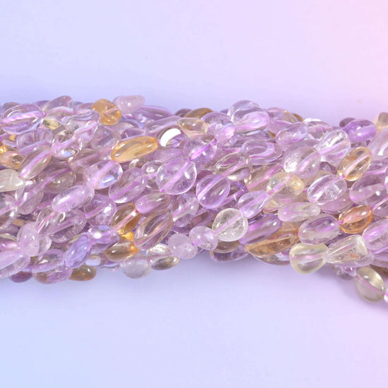 Ametrine pebble nugget gemstone beads.