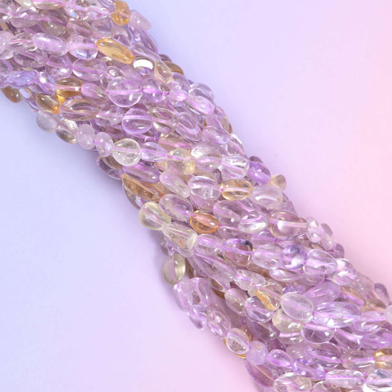 Ametrine pebble nugget gemstone beads.