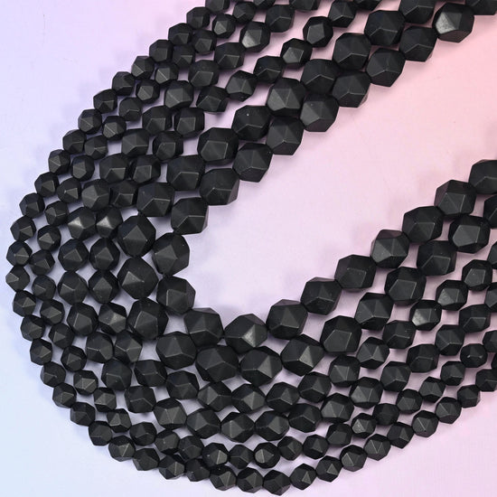 Matte Black Onyx Beads: Faceted Diamond Star Cut, 6-10mm, 15.5 inch Strand