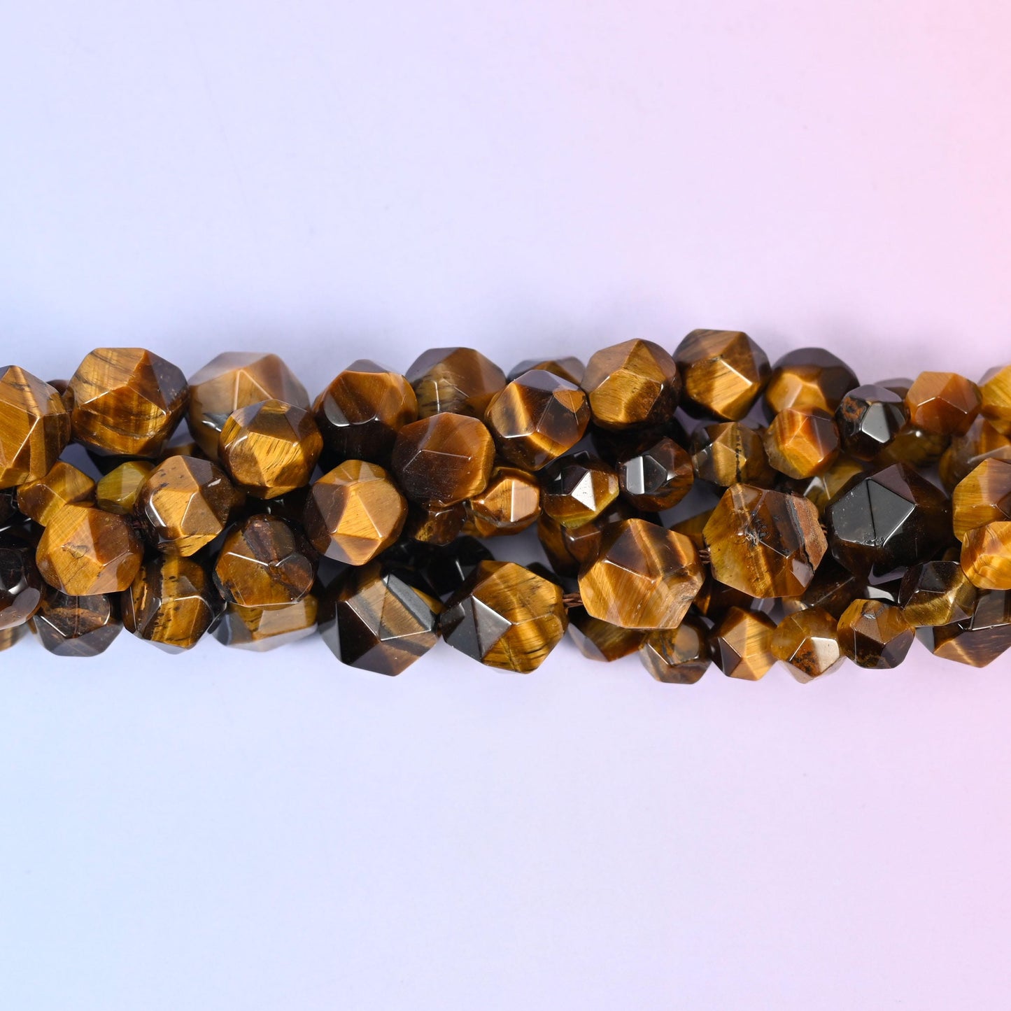 Tiger Eye Beads: Faceted Diamond Star Cut, 6-10mm, 15.5 inch Strand