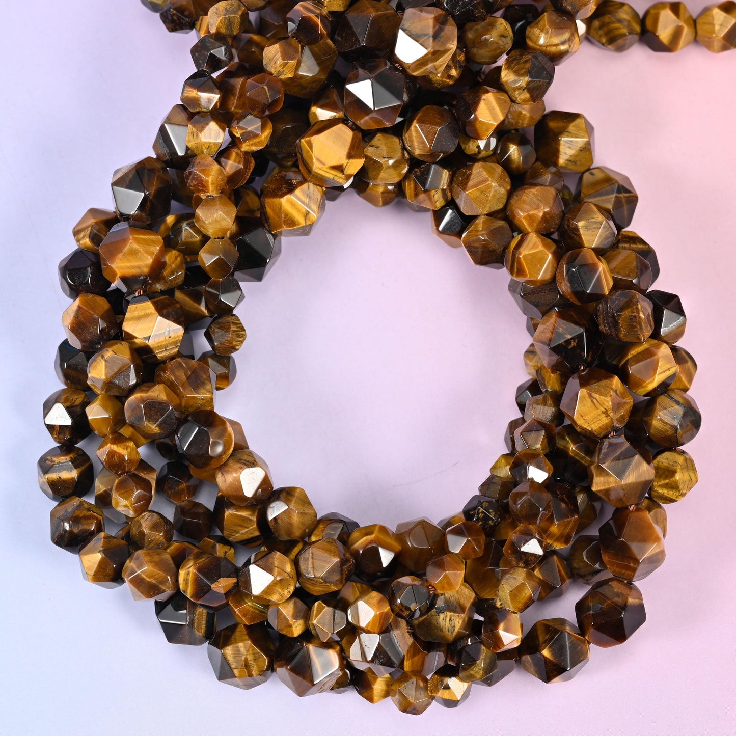 Tiger Eye Beads: Faceted Diamond Star Cut, 6-10mm, 15.5 inch Strand