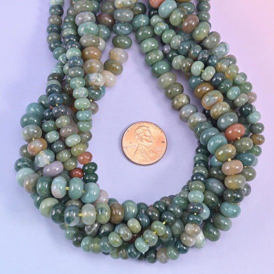 Indian Agate smooth rondelle beads with a US penny for scale, 4x6mm rondelles