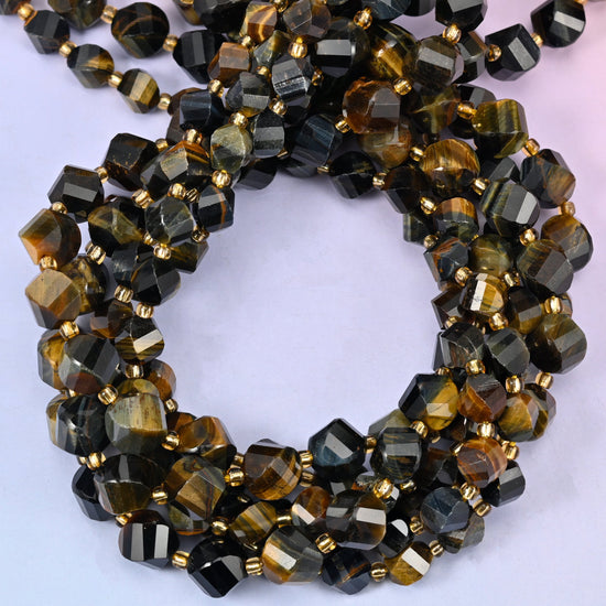 Iron Tiger Eye faceted spiral twist beads, close view of the coiled strands showing golden brown banded with steel grey and black