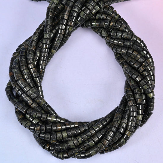 Kambaba Jasper smooth heishi disc beads, close view of the coiled strands showing dark green-black with mottled olive rings