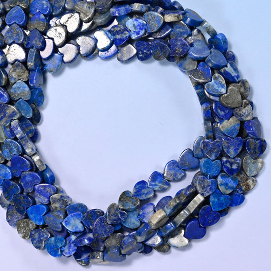 Lapis Lazuli flat heart beads, close view of the coiled strands in deep blue with grey and gold flecking