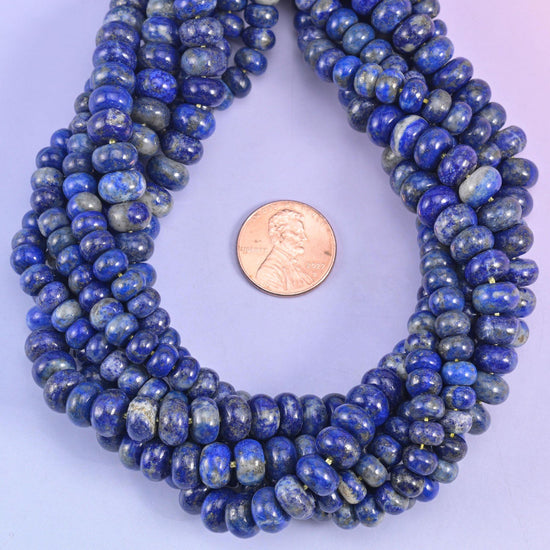 Lapis Lazuli smooth rondelle beads with a US penny for scale, 4x6mm rondelles