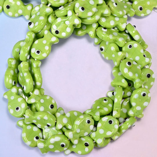 Lime Green with White Dot Fish glass beads, close view of the coiled strands in lime green with white spots