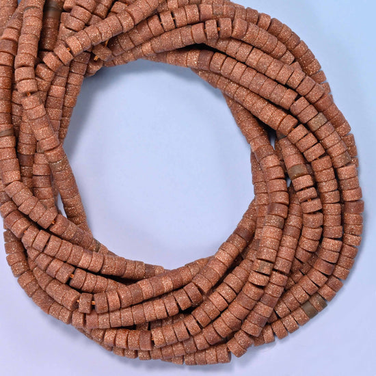 Matte Gold Sandstone heishi disc beads, close view of the coiled strands showing the even copper-brown color with a soft matte finish